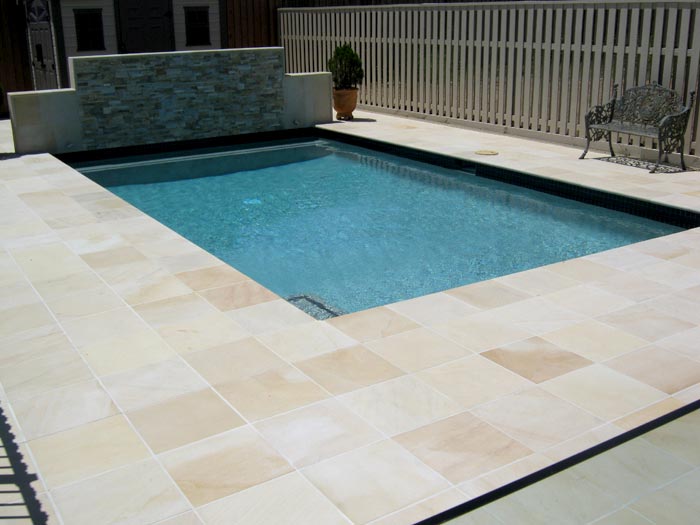 HQDrifting Sand stone tile or pool paver shown in situ with matching coping