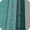 GC430 Kimberley used as waterline tiles and step marker tiles.Linen Travertine as surround tiles. 