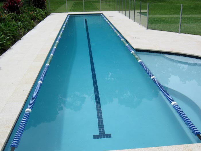 Almond Granite stone tile or pool paver shown in situ with matching coping