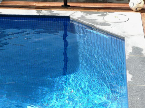 GCR050 Azure Blue glass mosaic pool tile shown in situ