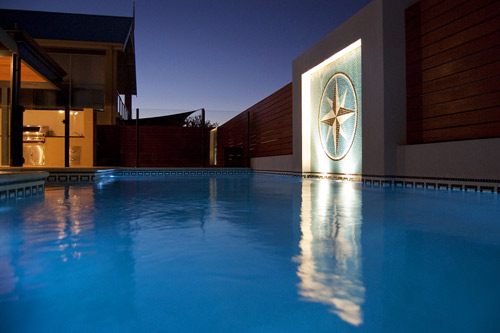 Black Gold White Greek Key mosaic pool tile shown in situ