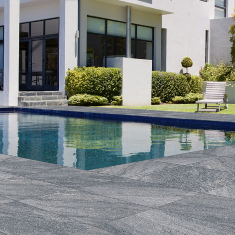 Cosmos Granito tiles shown around a pool