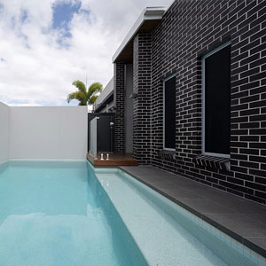 Meteor Granito tiles shown around a pool