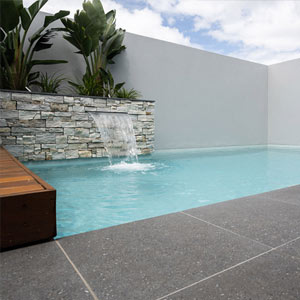 Meteor Granito tiles shown around a pool
