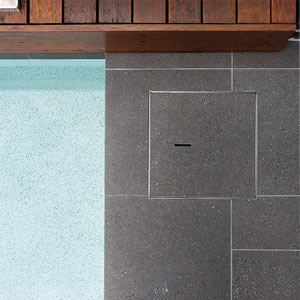 Meteor Granito tiles shown around a pool