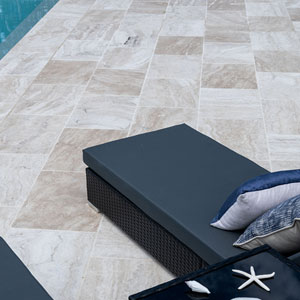 Ivory Travertine used as coping and surrounds of the tile