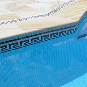 Greek Key Black, Caramel and White ceramic mosaic pool tiles shown as waterline tiles