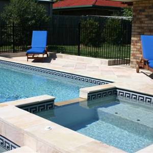 Greek Key Black, Caramel and White ceramic mosaic pool tiles shown as waterline tiles