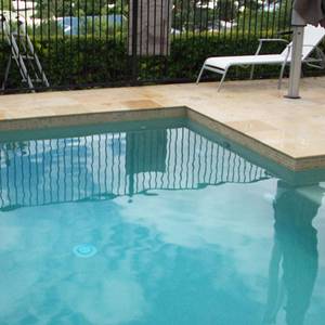CMC411 Sahara 23 x 47mm ceramic mosaic pool tiles in place
