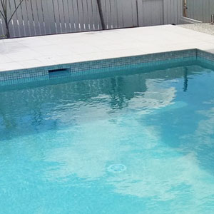 CMC473 Urban White (Ashlar) ceramic mosaic pool tiles in place