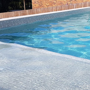CMC473 Urban White (Ashlar) ceramic mosaic pool tiles in place