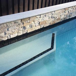 CMC475 Urban Black (Ashlar) ceramic mosaic pool tiles in place
