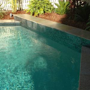 GC102 Charcoal Pearl glass mosaic pool tiles shown as waterline tiles