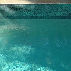 GC102 Charcoal Pearl glass mosaic pool tiles shown as waterline tiles