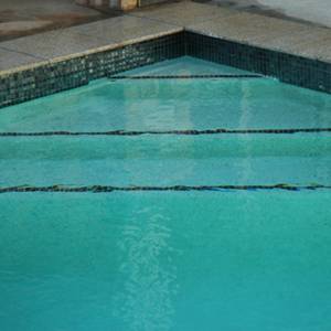 GC102 Charcoal Pearl glass mosaic pool tiles shown as waterline tiles