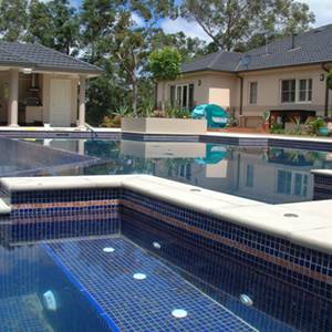 Pool and Spa tiled with GC125 Dark Blue Gold glass mosaic tiles showing deep blue water colour