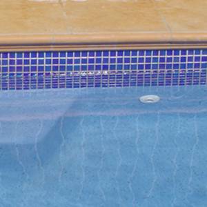 waterline mosaic pool tiles in place