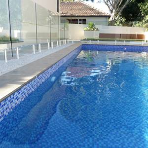 Pool interior tiled with GCR080 Mid Blue Blend Crystal 23mm mosaic tiles
