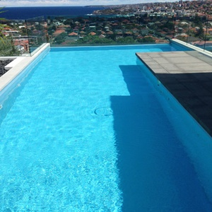 Swimming pool fully tiled with Powder Blue glass mosaic tiles