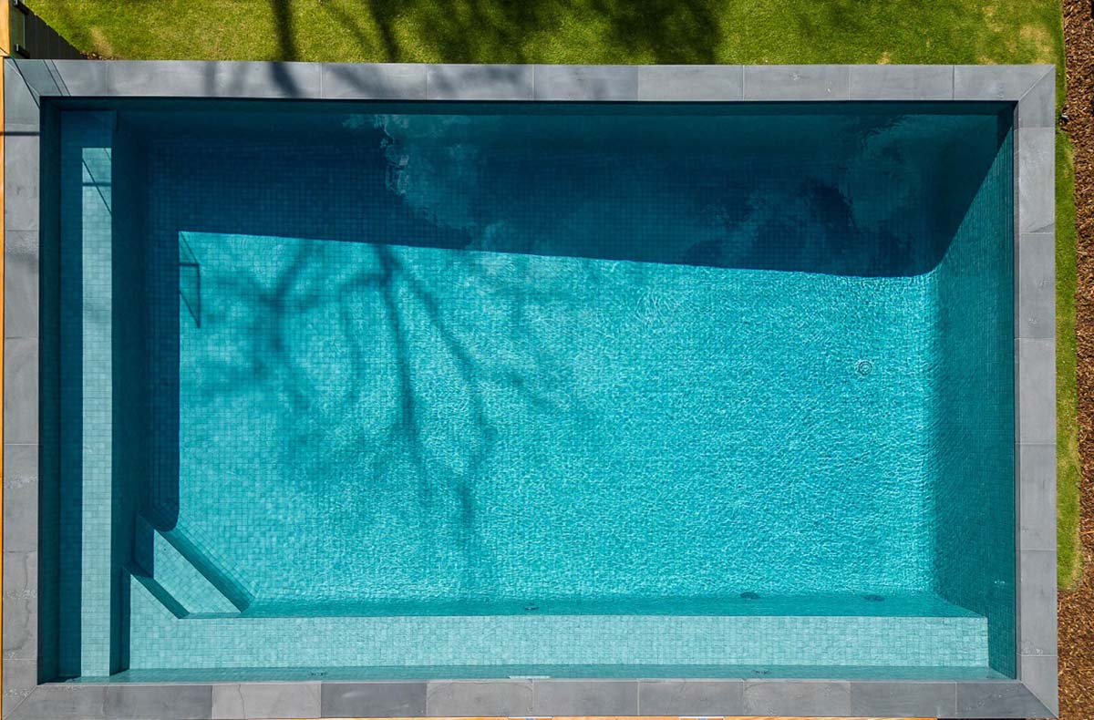 Peppercorn CMC105 fully-tiled pool aerial view partial sun