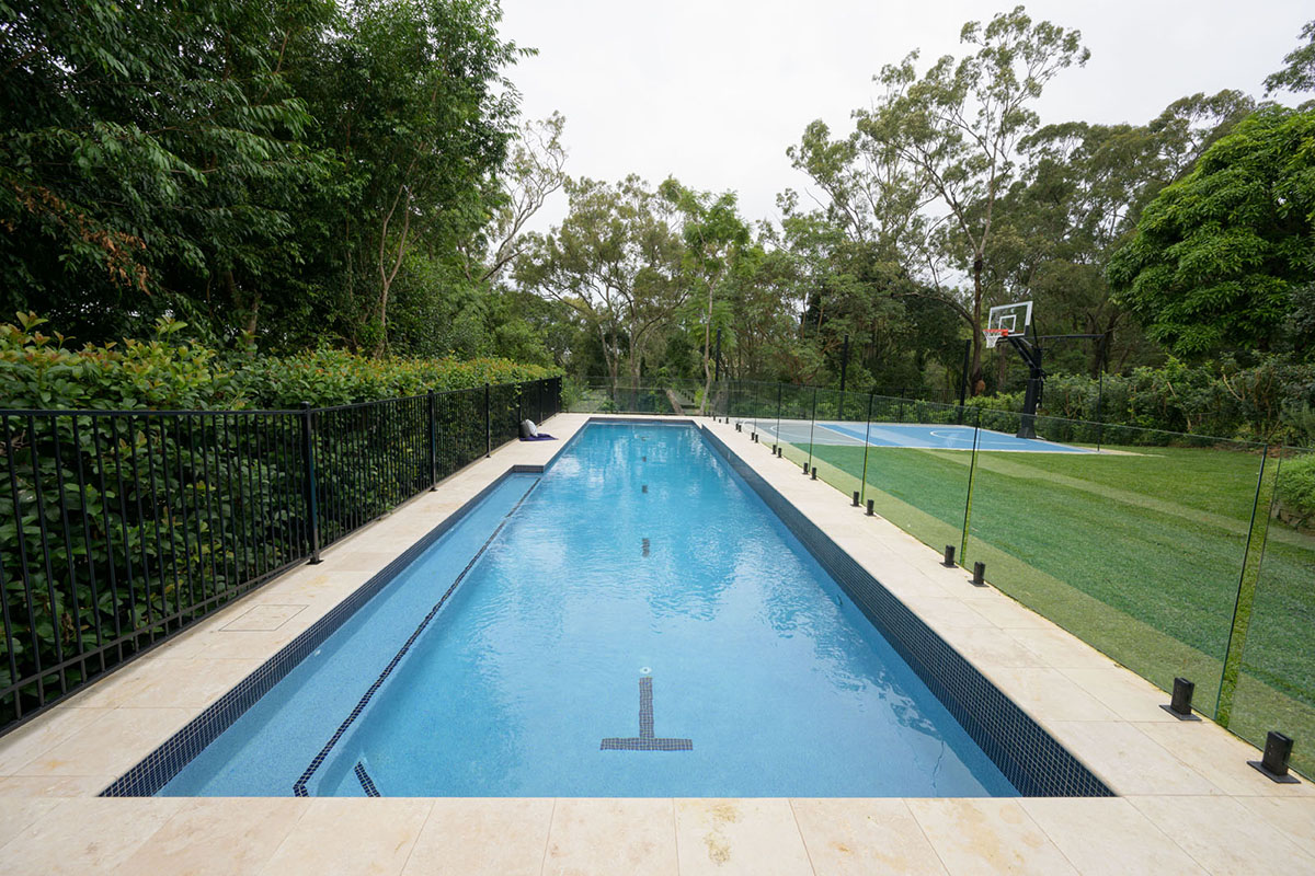 Macadamia Travertine coping and surrounds with Midnight Blue CMC144 waterline4