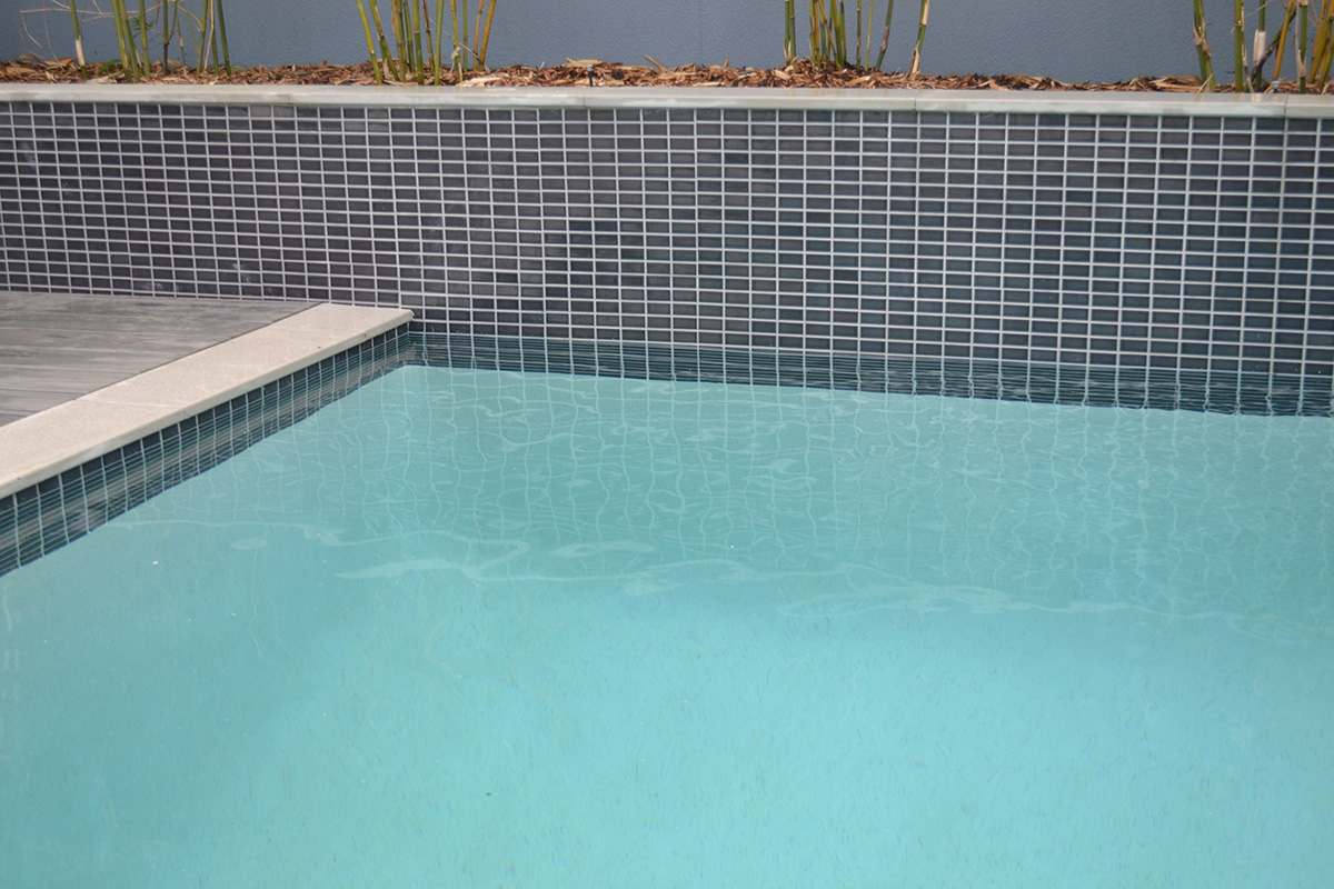 CMC306 Dark Grey waterline and tiled pool feature wall with Mercury Porcelain Square Edge coping
