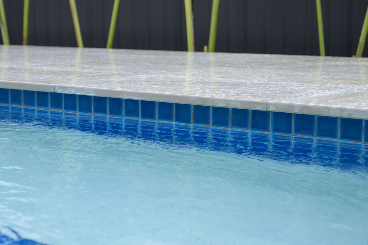 Coastal Cream Square Edge pool coping with Atlantic CMC331 waterline tile