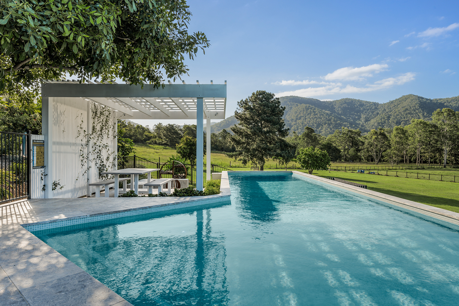 CMC570 Sea Mist Wavy 23mm 3 Silver Travertine coping and surrounds and Sea Mist waterline