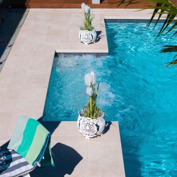 Stonehenge Kit Kat CMC660 ceramic mosaic tiles with calming tones used at the spa waterline for seamless spa integration by Pools By Design, Nambour Queensland.