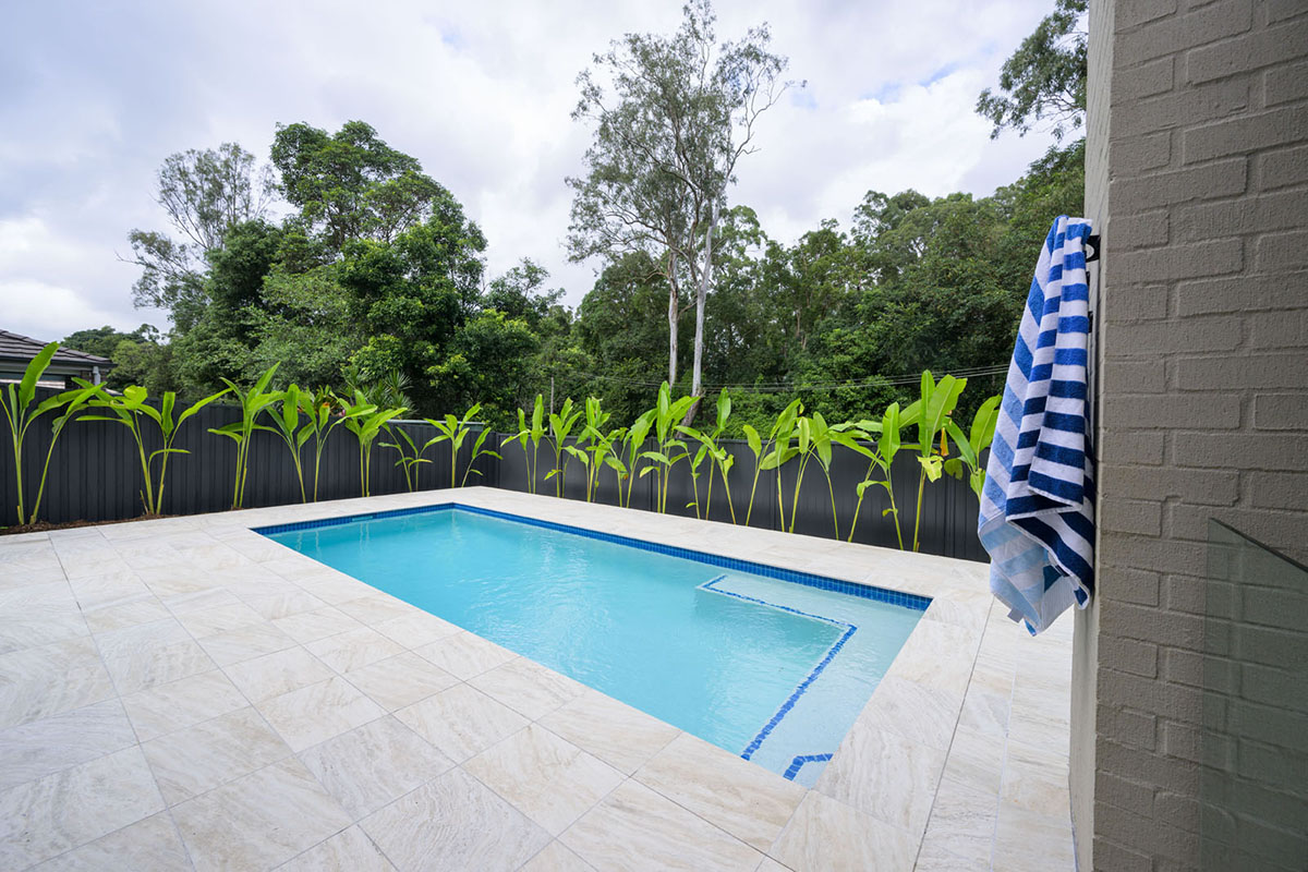 Coastal Cream Travertino pool coping and surrounds with Atlantic CMC331 waterline tile9