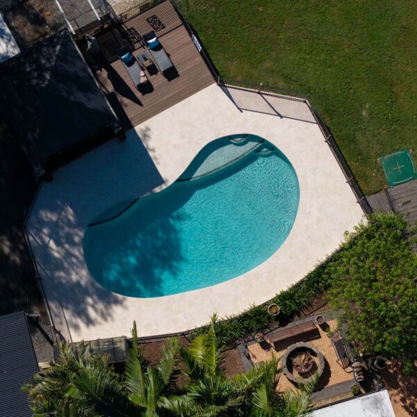 Bird’s eye view of neutral tone paving with non-slip tile surface in outdoor living area Belivah Queensland