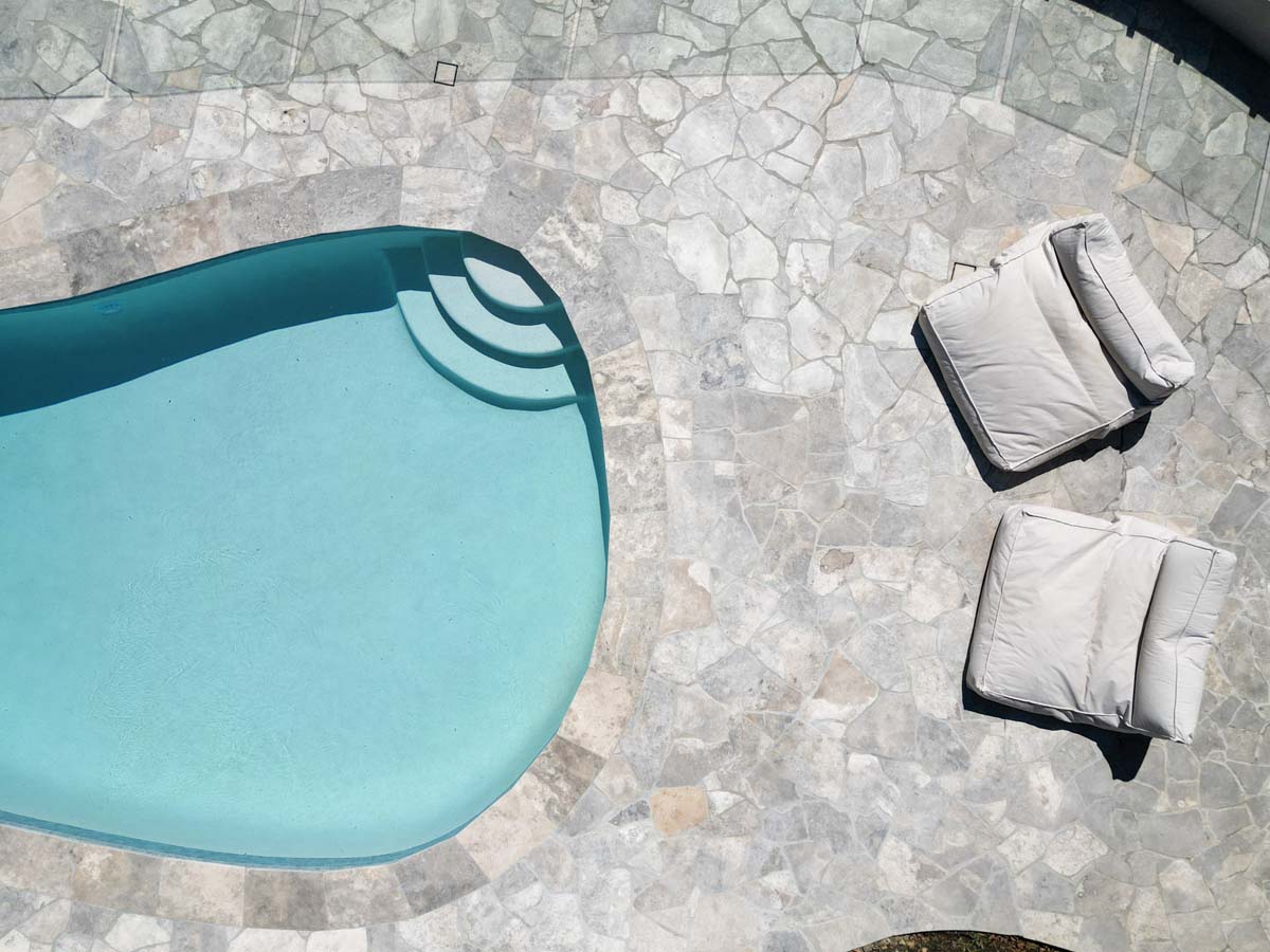 Silver Travertine Crazy Pave 2 Silver Travertine Coping Crazy Pave With Gunmetal Blue Waterline 2