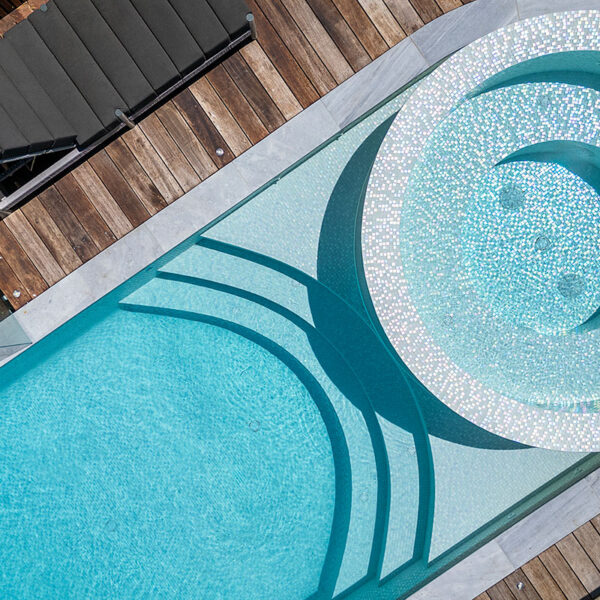 Aerial view White Crystal Pearl Blend fully-tiled pool wet edge spa