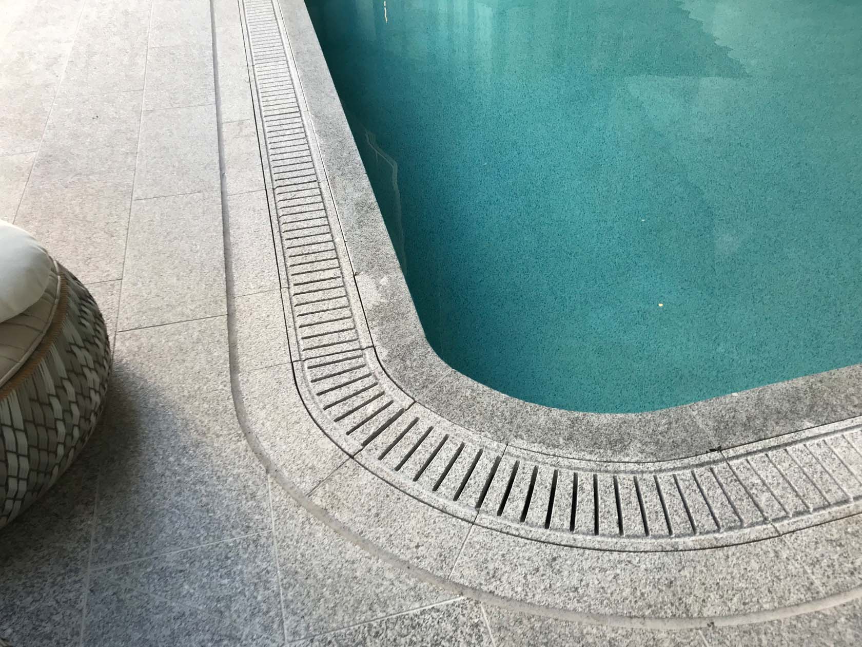 Light Grey Granite pool coping tiles and matching pool grates