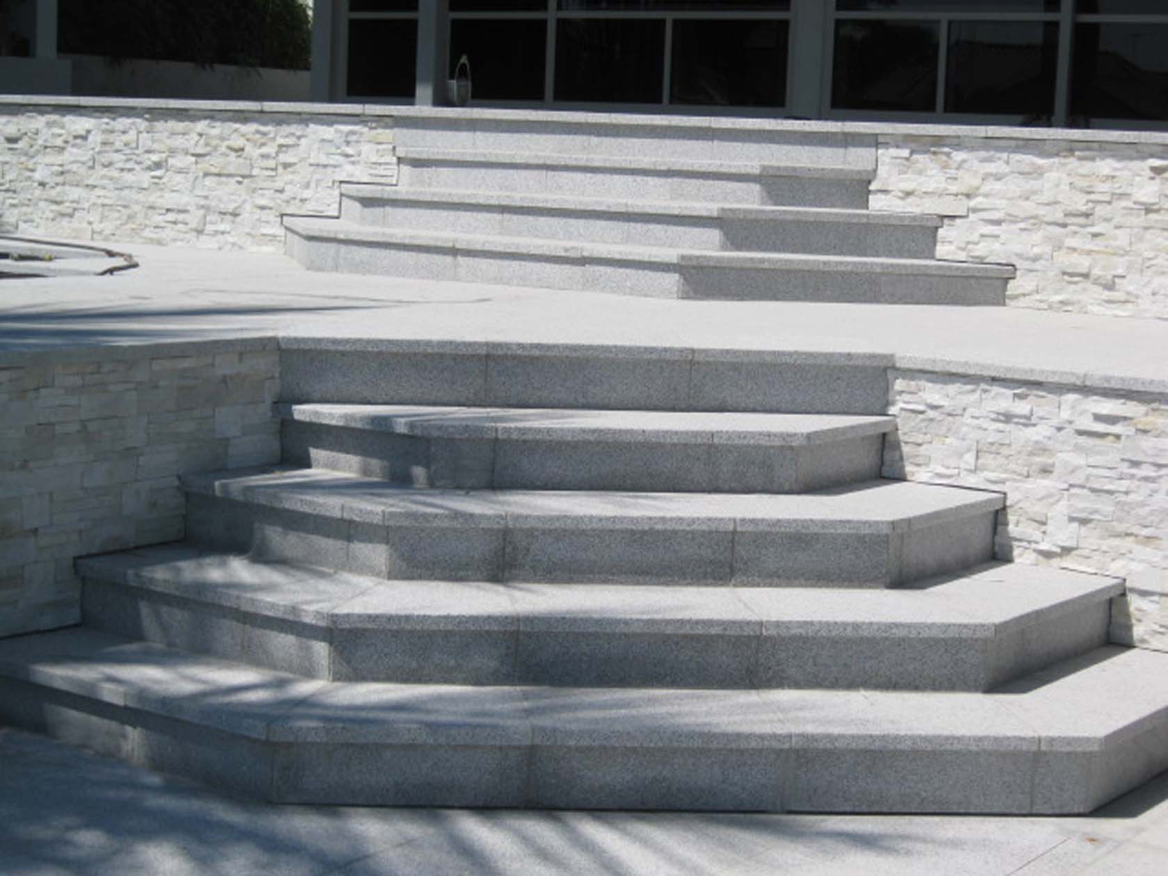 Light Grey Granite tiled steps with and SS315 Contempo Gold stone cladding