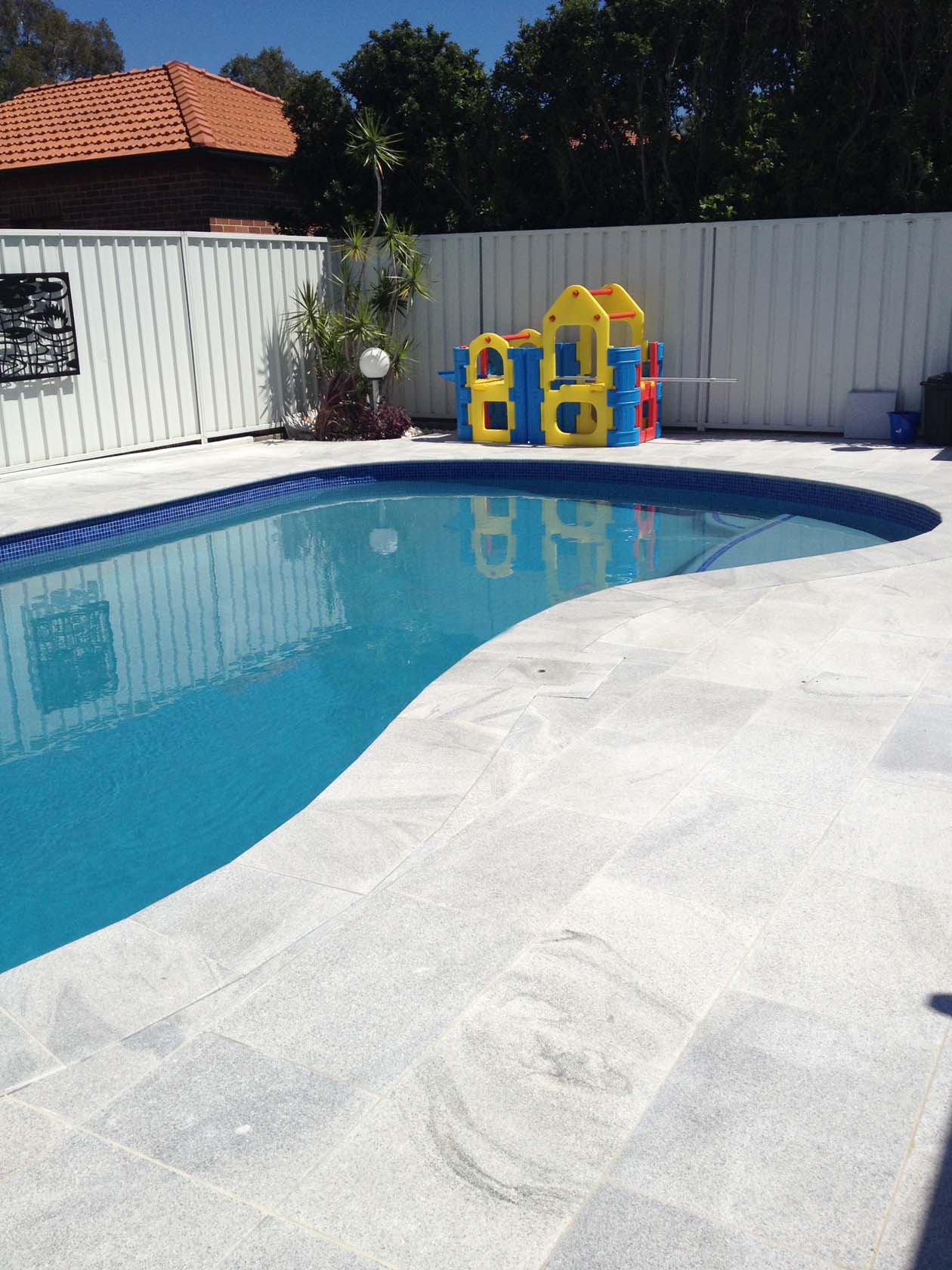 Sandwave Granite Natural Stone pool coping and surround tiles