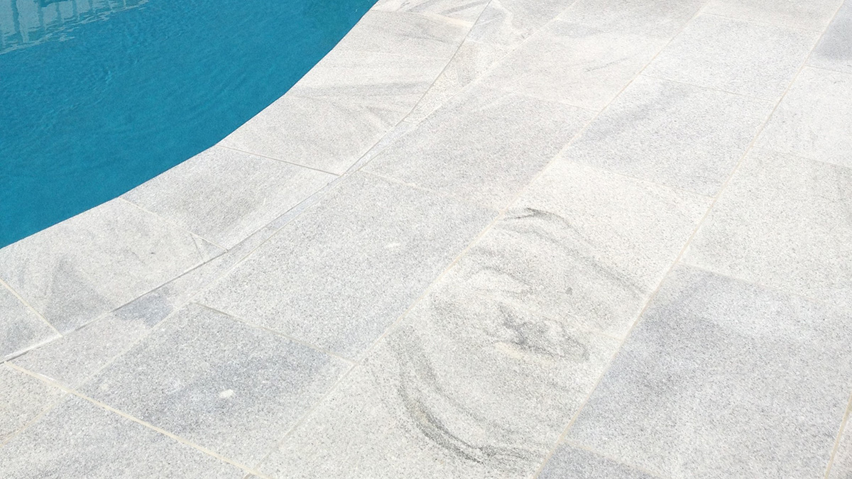 sandwave granite pool coping and surround tile