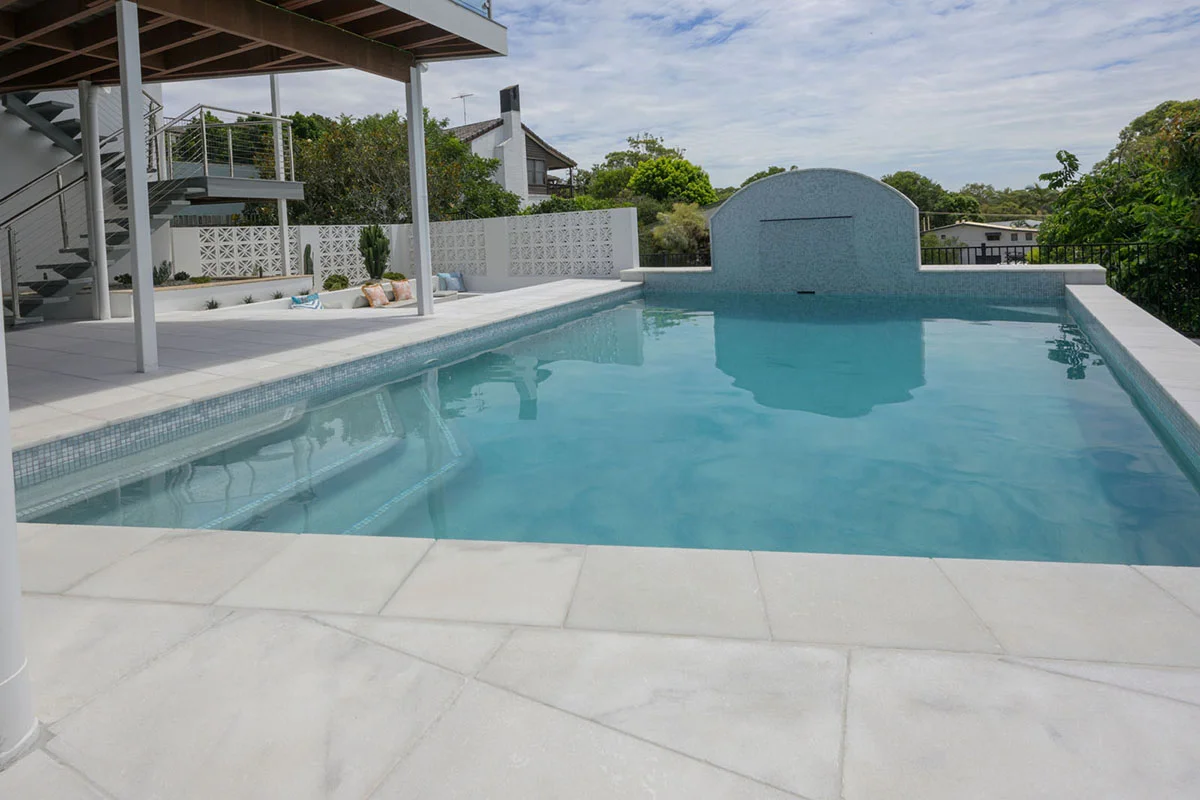 Havana White Marble square edge coping and surrounds & GC420 Alpine glass mosaic waterline and step marker