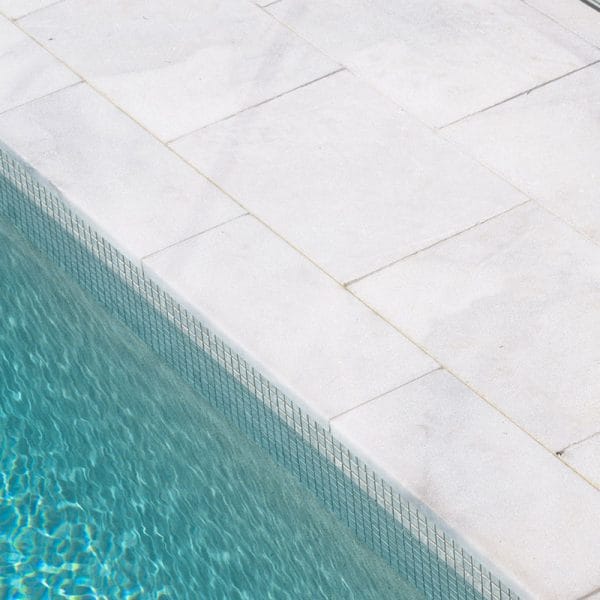 Highland Grey Marble square edge coping and surround + CMC564 Ash Grey Wavy waterline tile