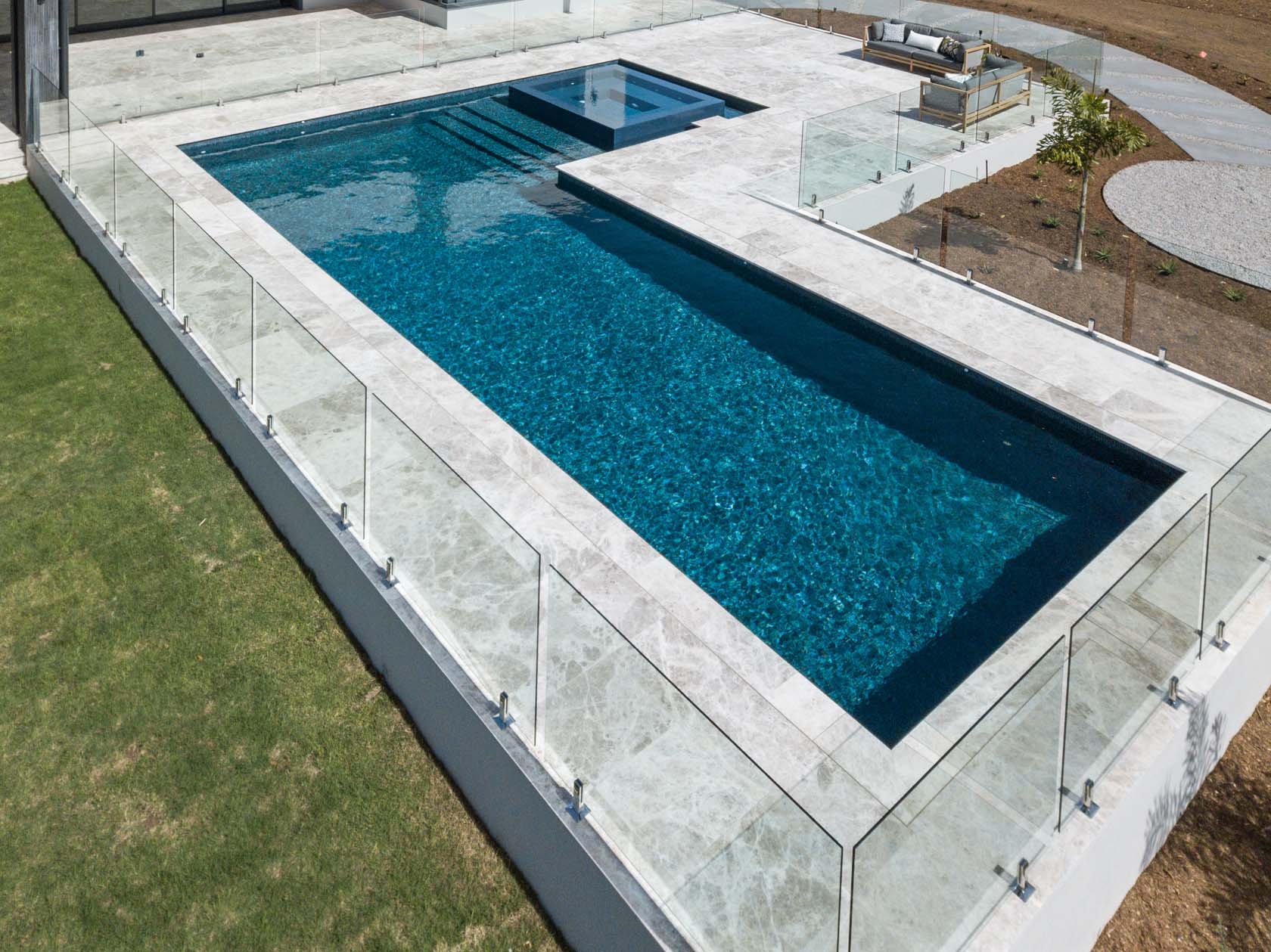 Silver Marble coping and surrounds with fully tiled pool in Peacock Glass