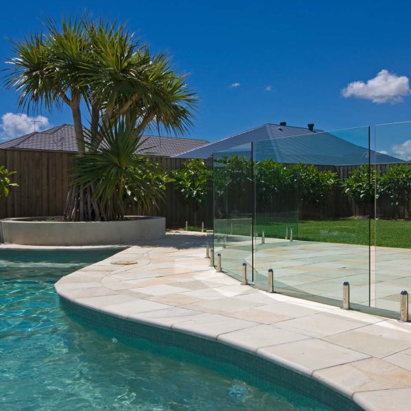 Natural Himalayan Sandstone bullnose pool coping and surrounds with Ice Blue waterline tiles