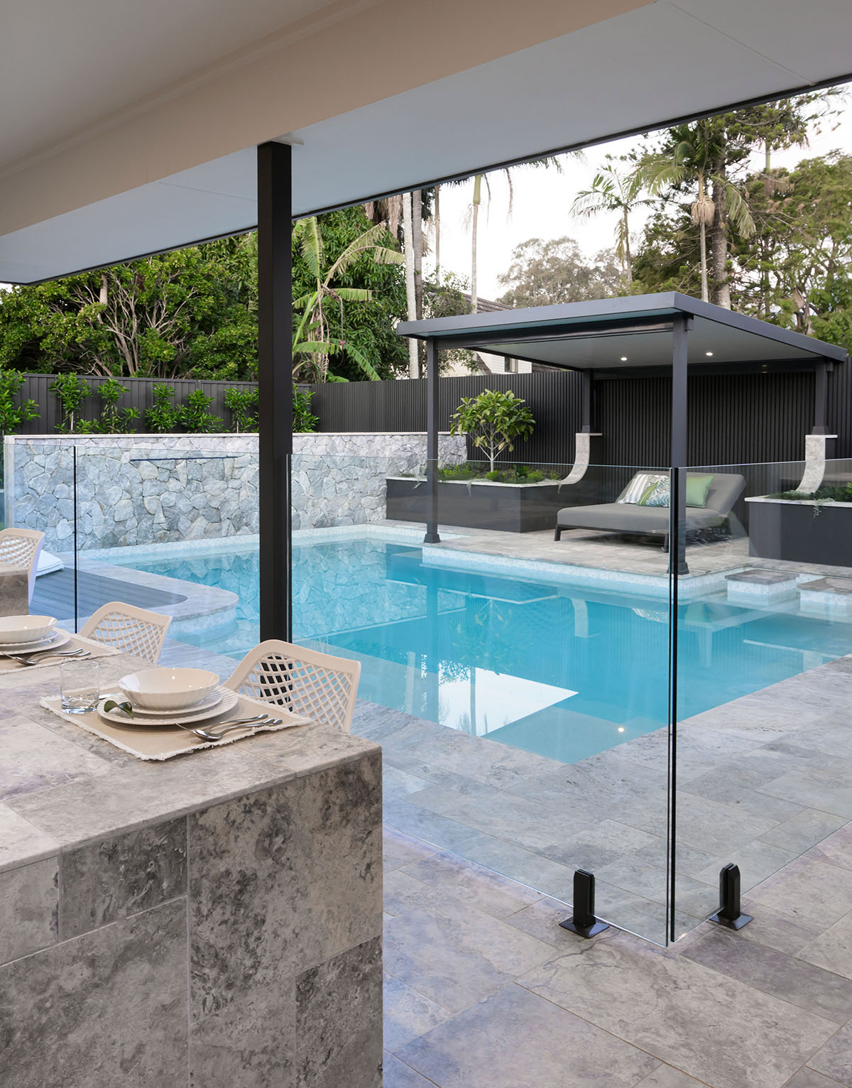 Stunning White Crystal Pearl Blend fully-tiled pool and spa with tiled exterior