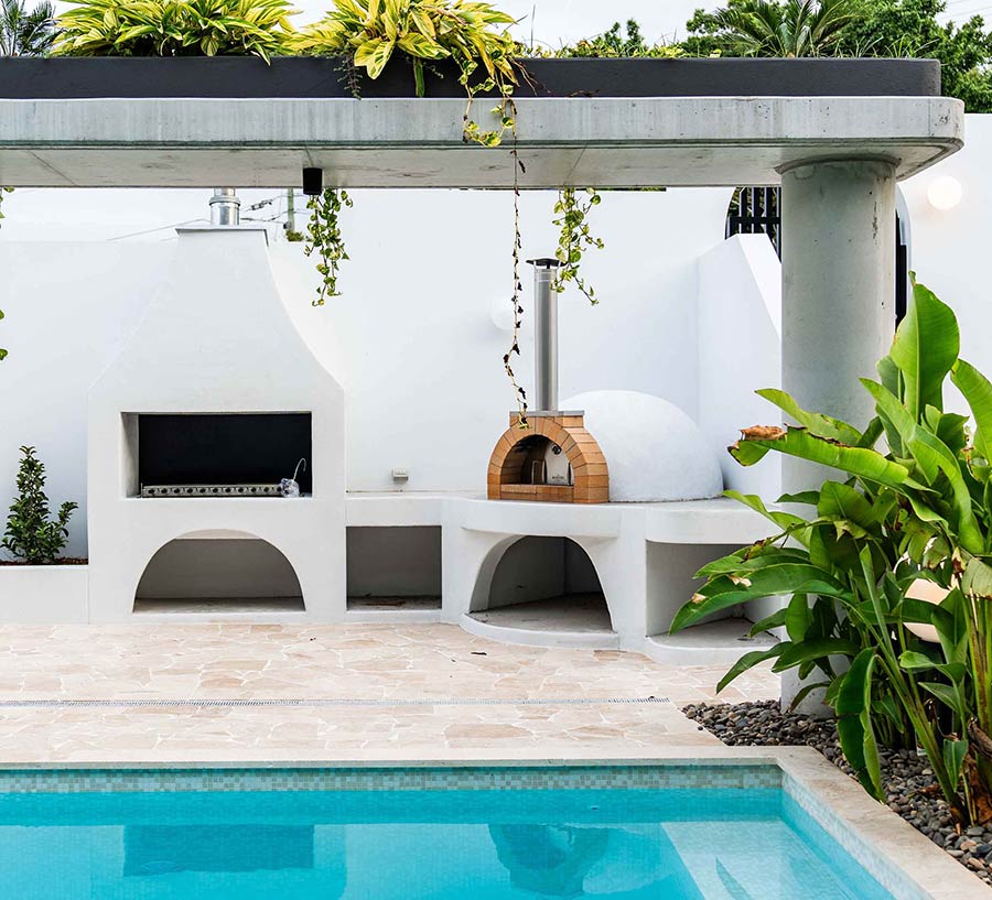 Pool with outdoor barbecue and pizza oven