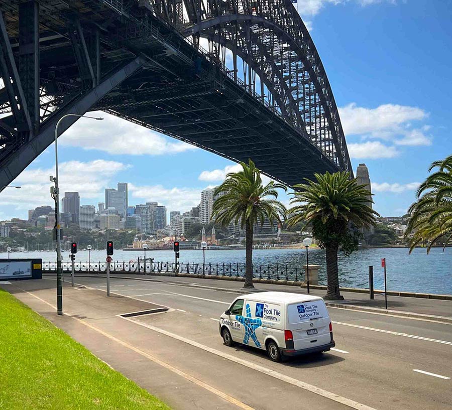 Sydney harbour bridge with Pool Tile Company mobile showroom van in foreground