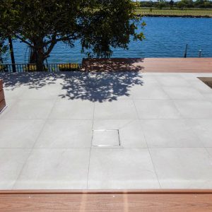 HIDE drain cover inlay kit shown installed into outdoor area