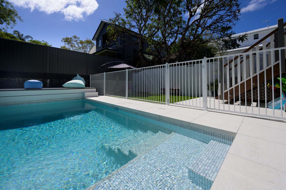 Coconut Drift Porcelain dropface coping and surounds achieves a white and bright pool coping tile for any pool area.