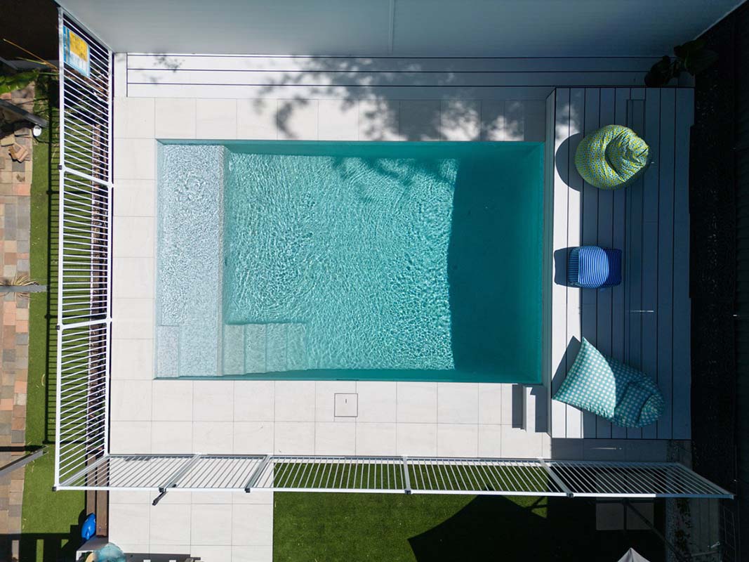Coconut Drift Porcelain with coping and surrounds achieves a bright, cool and luxe look to any pool area with natural lookalike patterns and textures.