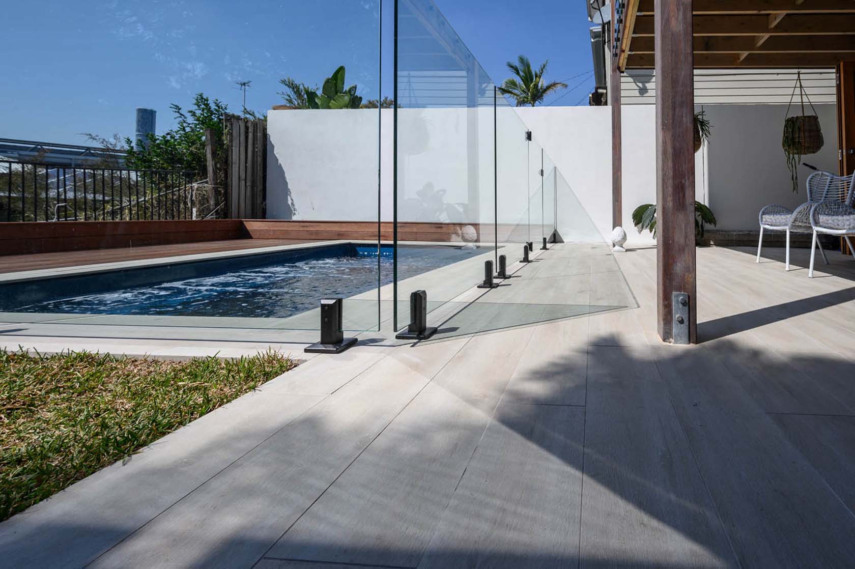 Beige TileDeck pool coping and outdoor tiled area