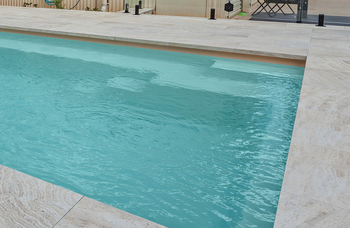 Coastal Cream Travertino Triple Joint coping and pool surround paving