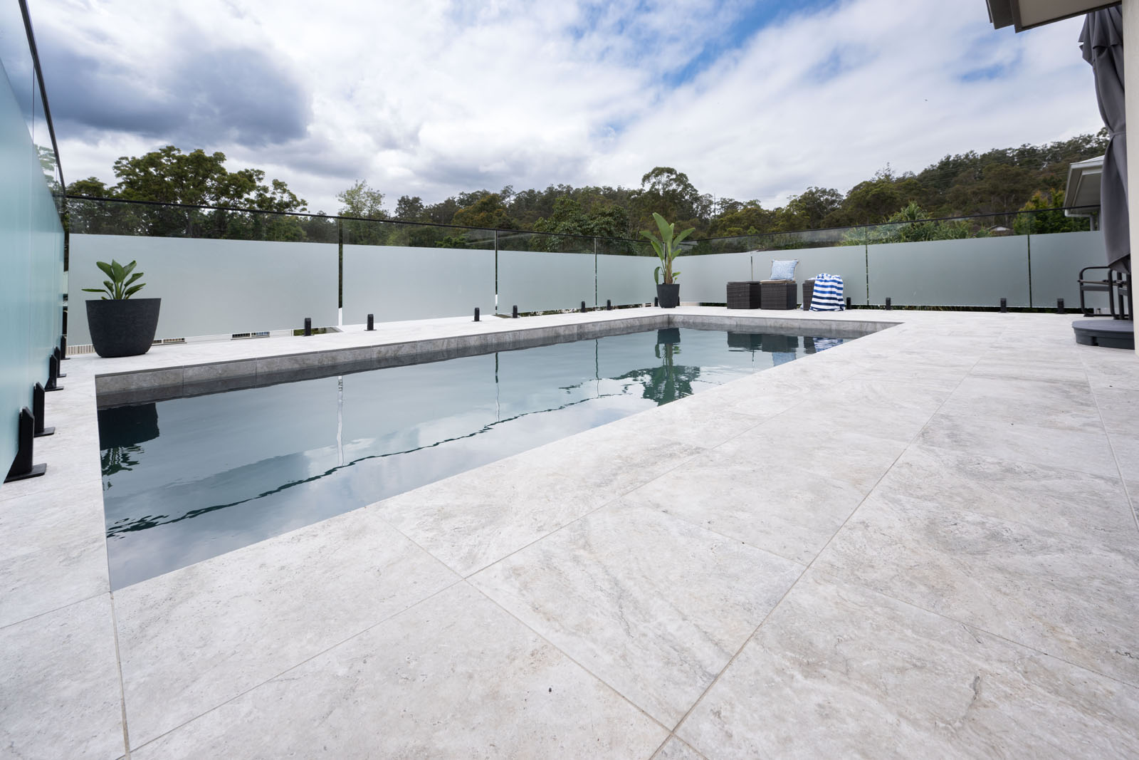 Rustic Grey Travertino pool coping and surrounding tiles4